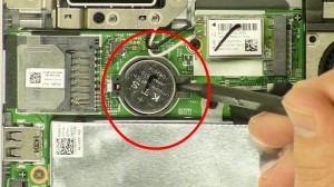 Using a scribe, remove the CMOS battery.