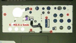 Remove the 6 - M2.5 x 5mm screws under the keyboard.