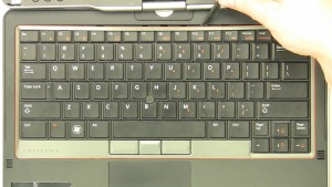 Carefully unsnap & remove the keyboard bezel.