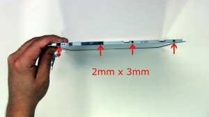 Remove the hinge rail screws on the left side of the screen and remove the hinge rail (4 x M2 x 3mm).