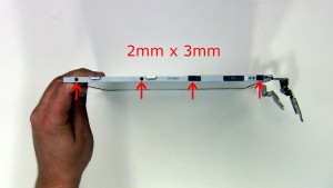 Remove the hinge rail screws on the right side of the screen and remove the hinge rail (4 x M2 x 3mm).