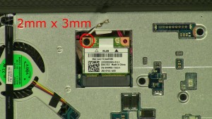 Remove the 1 - M2 x 3mm wireless card screw.
