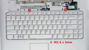 Remove the 2 - M2.5 x 5mm keyboard screws.