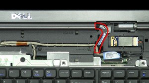 Pull the antenna cables through the laptop base.