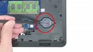 Use a plastic scribe to remove the CMOS Battery.
