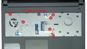 Remove the 6 - M2.5 x 5mm screws under the keyboard.