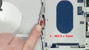 Remove the 1 - M2.5 x 5mm screw. 