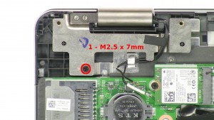 Remove the 1 - M2.5 x 7mm left hinge screw.