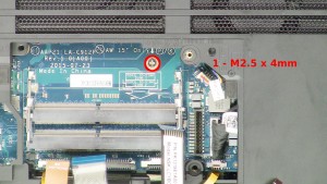 Remove the 1 - M2.5 x 4mm screw under the memory.