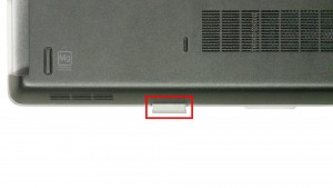 Press the SD Card in to eject it from the laptop.
