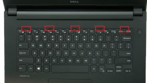 Press in tabs and turn over Keyboard.