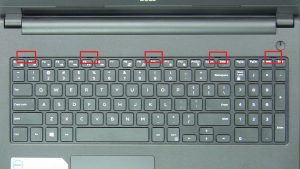 Press in tabs and turn over Keyboard.