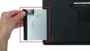 Press in button and remove DVD Optical Drive.