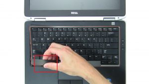 Use fingers to pry apart and remove Keyboard Bezel.