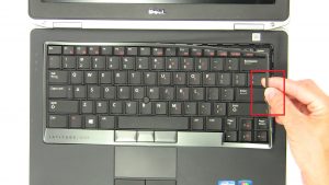 Use fingers to separate Keyboard Bezel.