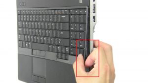 Use fingers to separate and remove Keyboard Bezel.