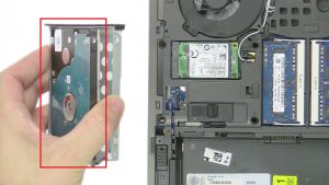 Press out Hard Drive from underside of caddy.