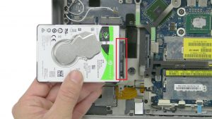 Unscrew and remove bracket and Hard Drive (2 x 