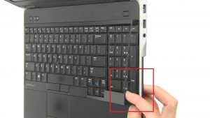 Use fingers to pry apart and remove Keyboard Bezel.