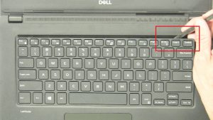 Use thin object to pry apart and turn over keyboard.