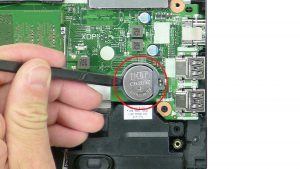 Use thin object to pry out CMOS Battery.