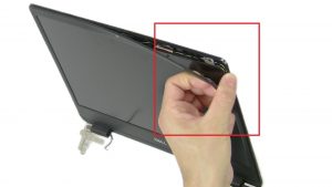 Use fingers to carefully separate and remove Display Bezel.