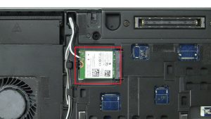 Unscrew bracket and disconnect WLAN Card 