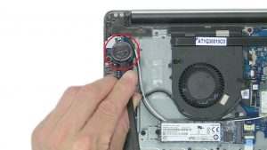 Use plastic scribe to pry out and remove CMOS Battery.