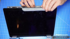 Use a plastic scribe to separate the back cover from the LCD screen.