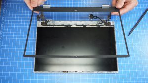 Use a plastic scribe to unsnap and separate the LCD Bezel.