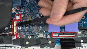 Disconnect motherboard cables. Use a plastic scribe to unclip connectors where needed.