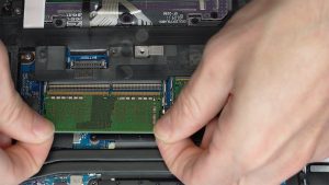 Separate the clips and slide out the RAM/Memory.
