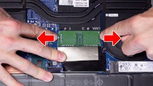 Separate clips outwardly to release the RAM/Memory.