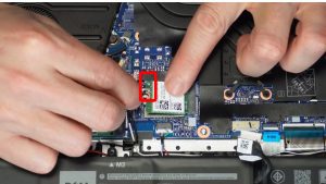 Disconnect the antenna cables and then slide out the WiFi Card.