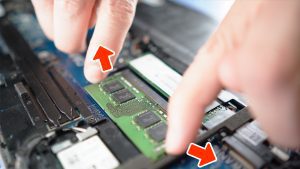 Separate clips outwardly to release the RAM/Memory.