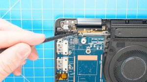 Unscrew and remove the power button cable bracket (1 x M2 x 2mm).