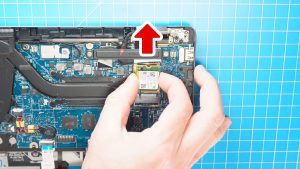 Use a Phillips Screwdriver to unscrew and remove the SSD bracket (1 x 