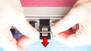 Unscrew and slide off the LCD cable bracket )1 x 1.6mm x 1.8mm).