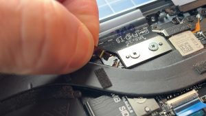 Unsnap the locking tab and disconnect the cooling fan cable.